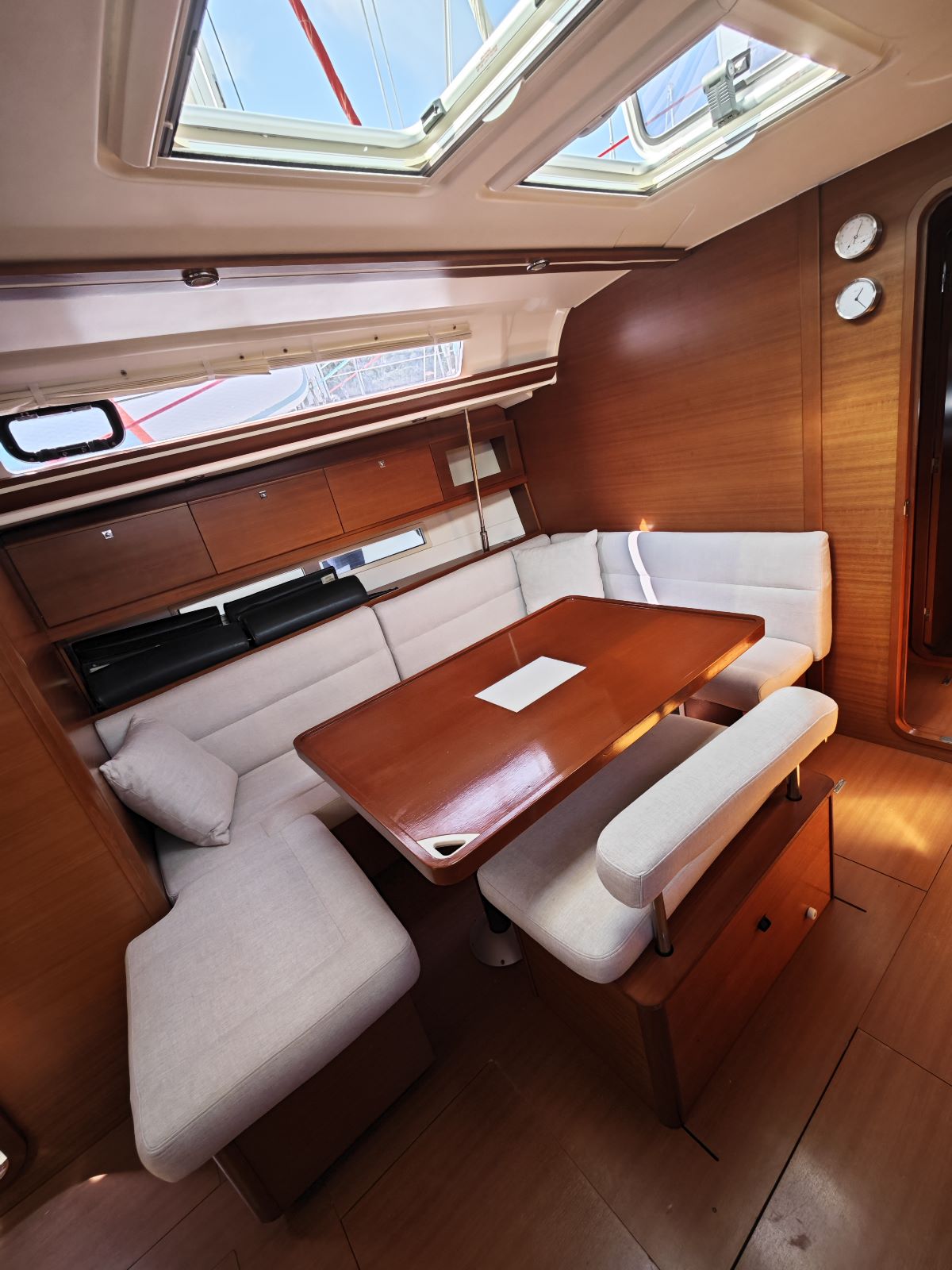 Saloon table in sailing yacht Dufour 450 Grand Large Grace in Fethiye in Turkey
